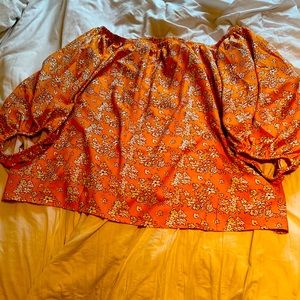 Mustard color with white flower accents, off the shoulder top